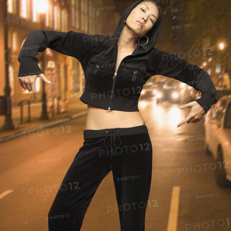 Asian woman posing in street