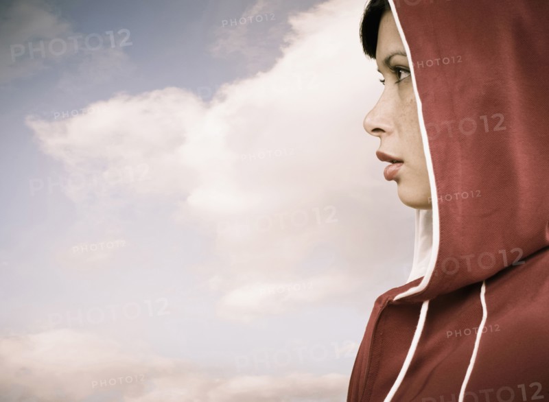 Mixed race woman wearing hoodie outdoors