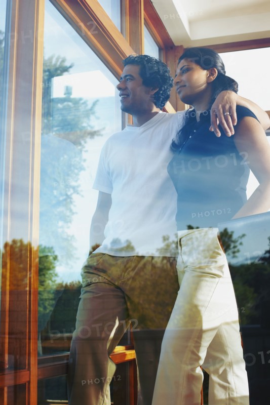 Couple looking through window