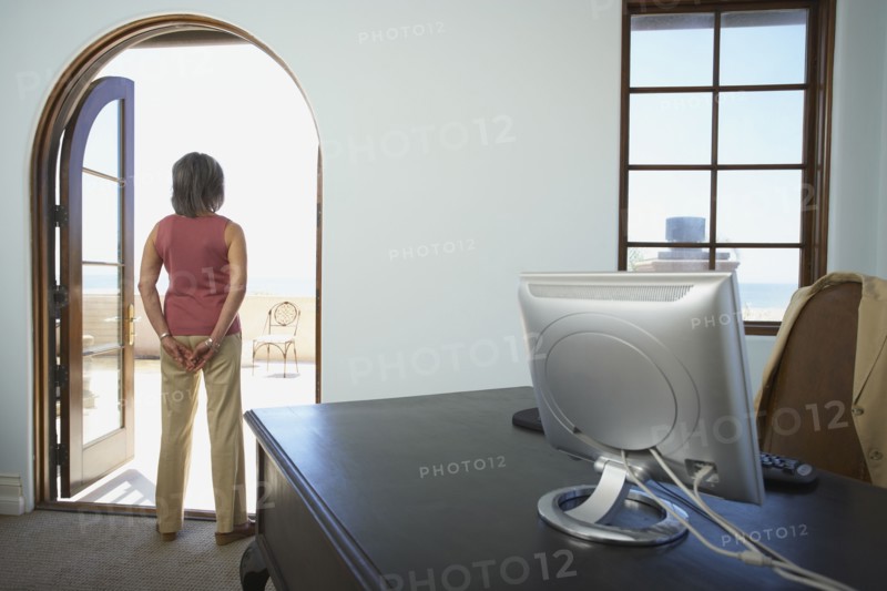 Businesswoman standing in doorway of office