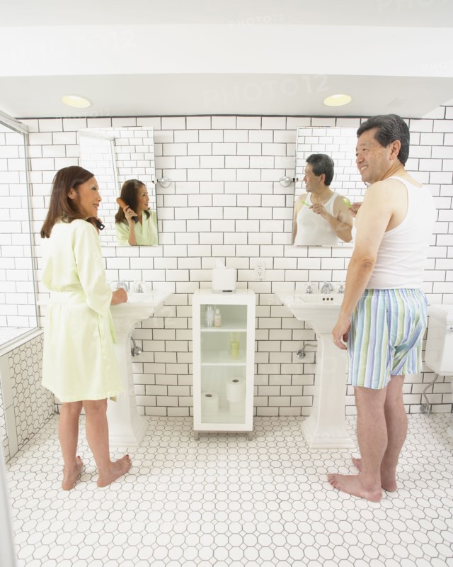 Asian husband and wife in bathroom together