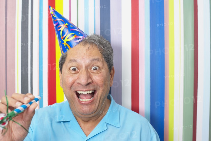 Hispanic man in party hat