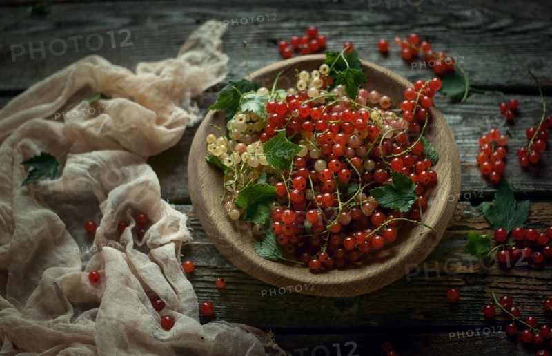 Berries in bowl on wooden table