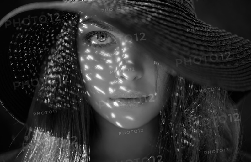 Caucasian woman wearing sun hat
