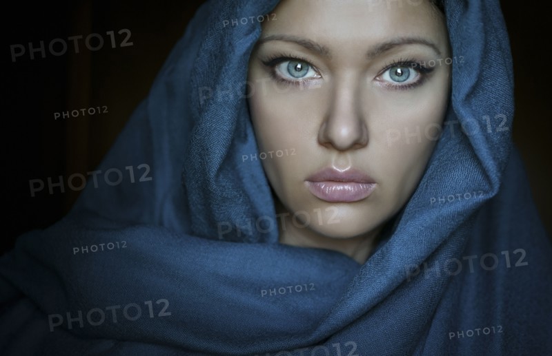 Caucasian woman wearing blue headscarf