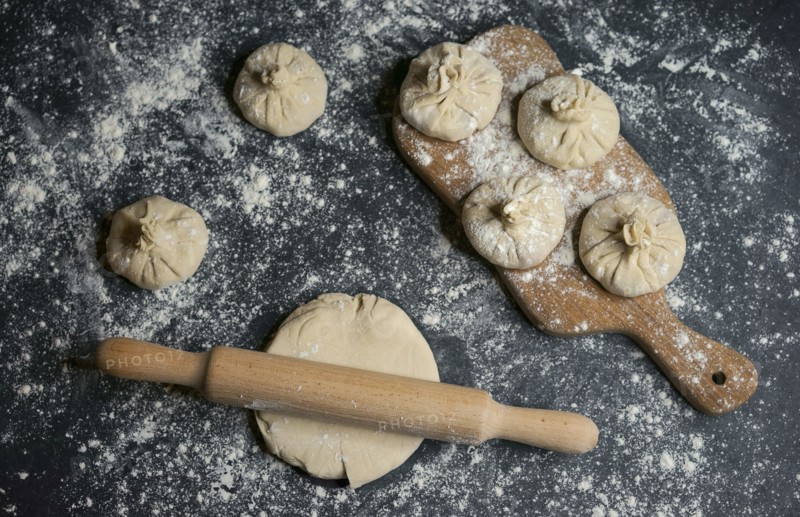 Flour on rolling pin and dough