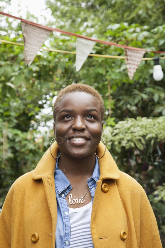 Portrait of smiling Black woman looking up