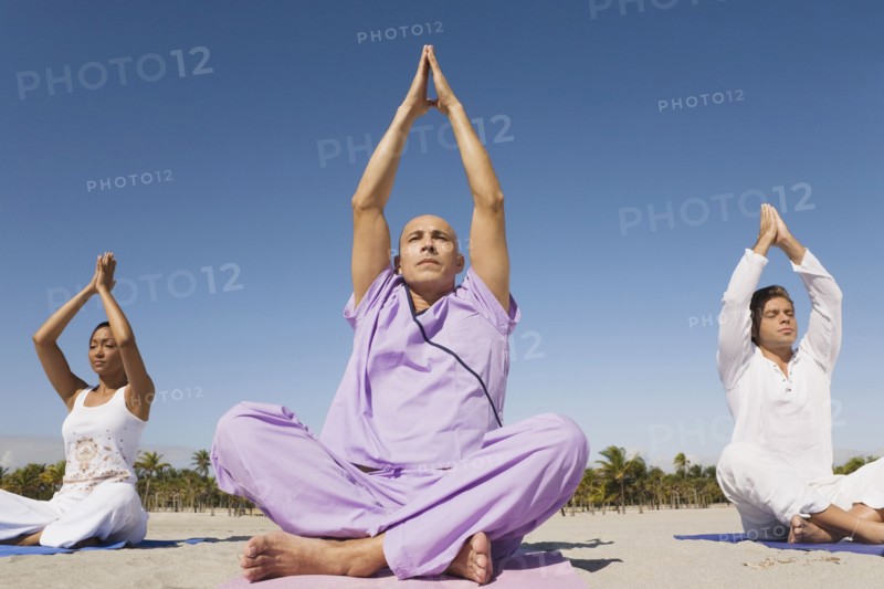 Hispanic people practicing yoga