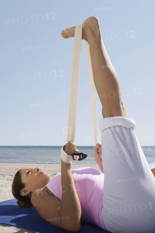 Hispanic woman practicing yoga