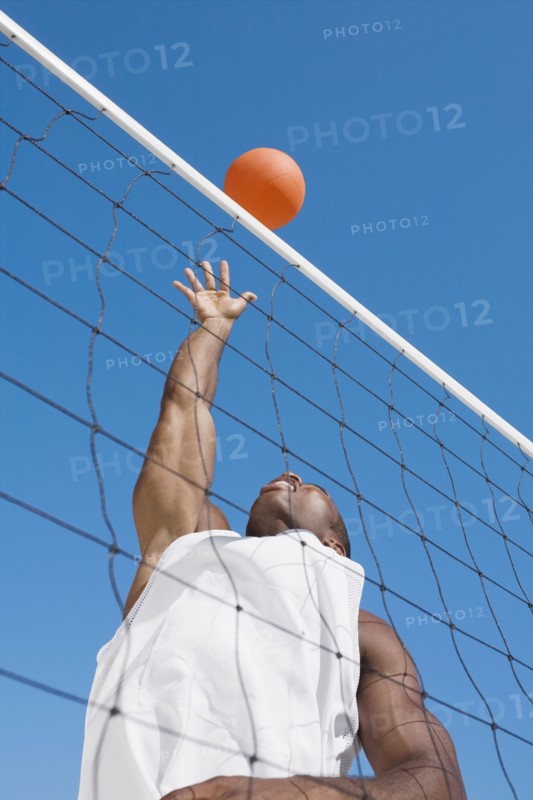 African man playing volleyball