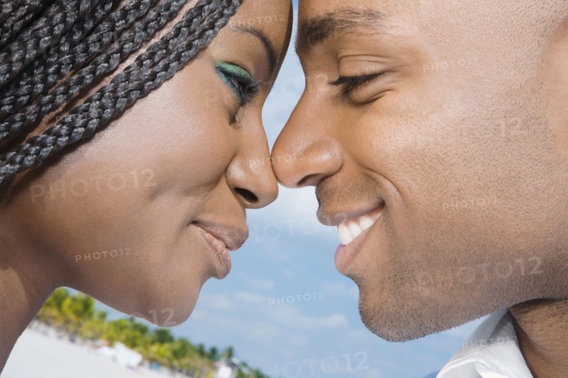 African couple smiling at each other