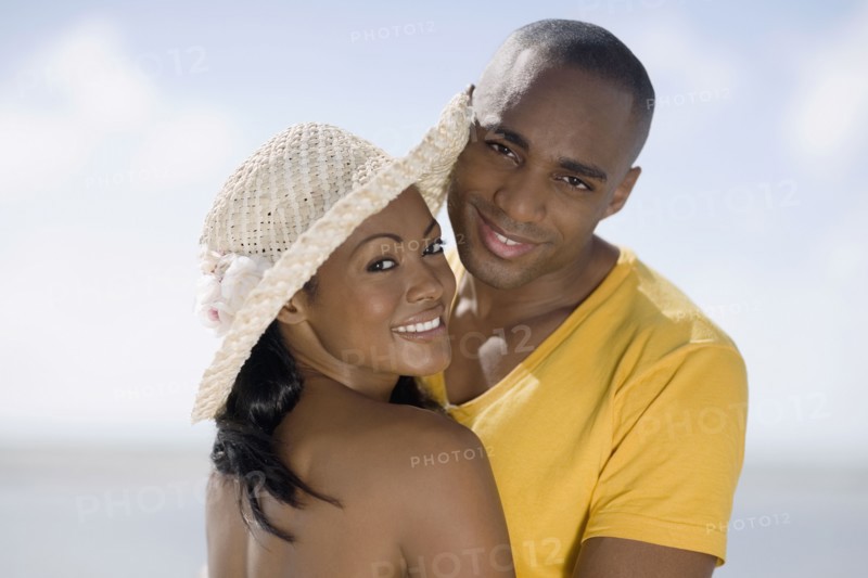 Multi-ethnic couple hugging