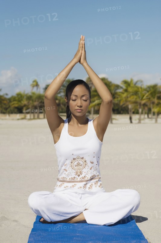 Hispanic woman practicing yoga