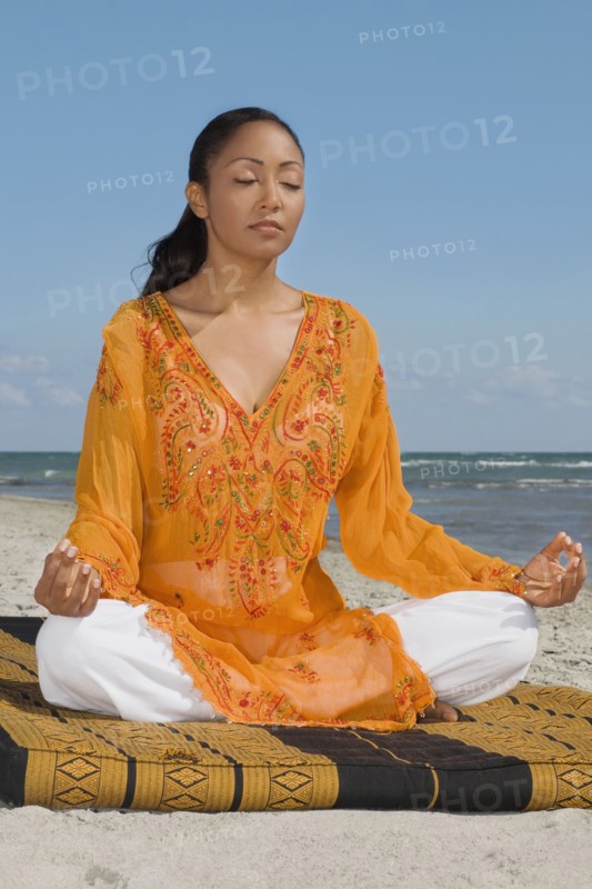 Hispanic woman meditating