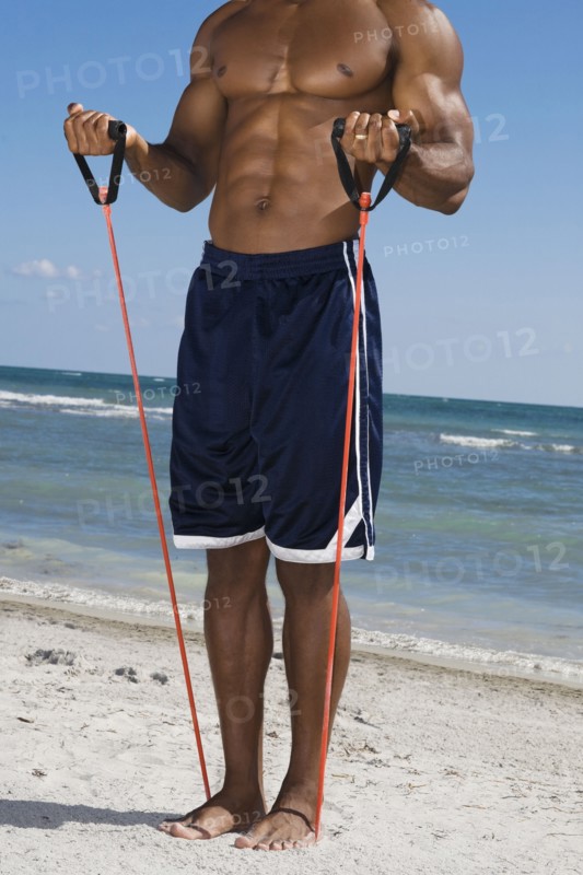 African man stretching with exercise band