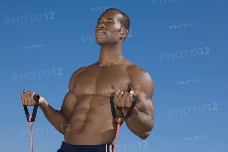 African man stretching with exercise band