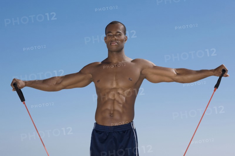 African man stretching with exercise band