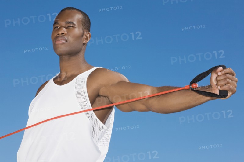 African man stretching with exercise band