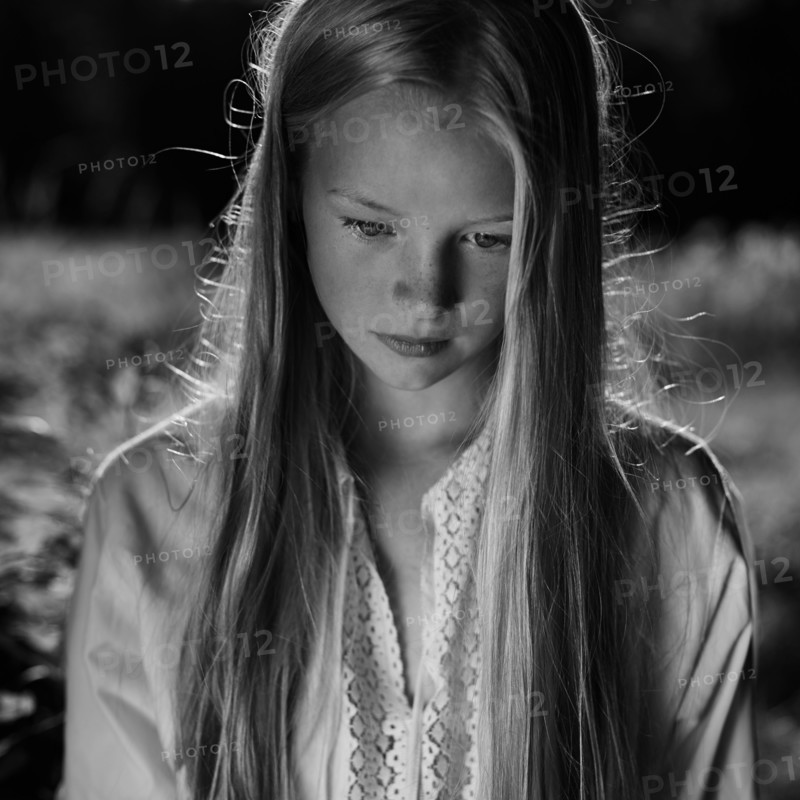 Caucasian girl looking down