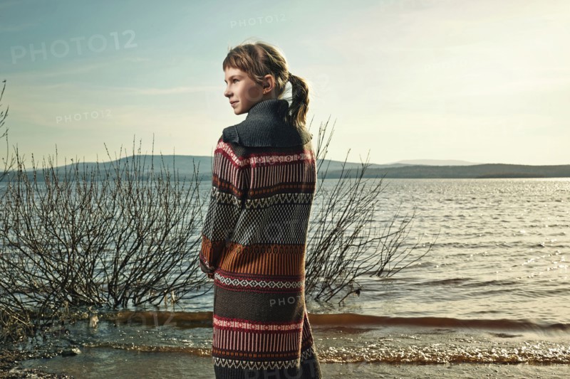 Caucasian girl standing on beach