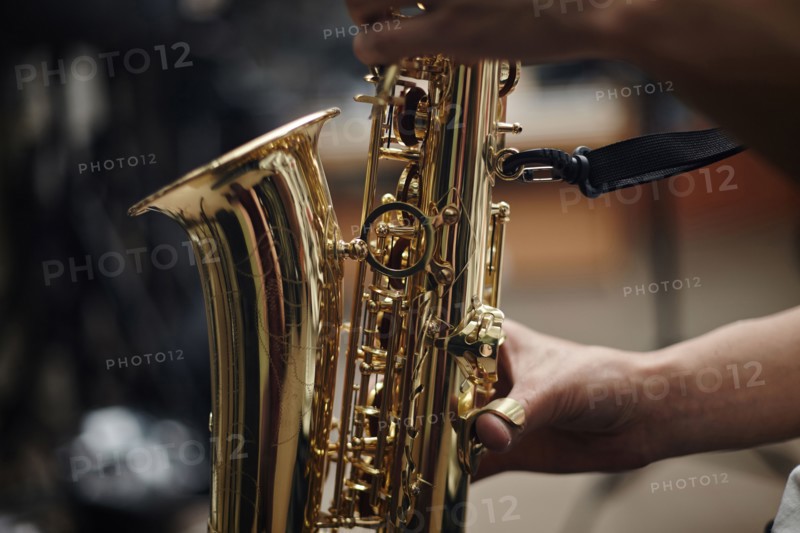 Close up of Caucasian man playing saxophone