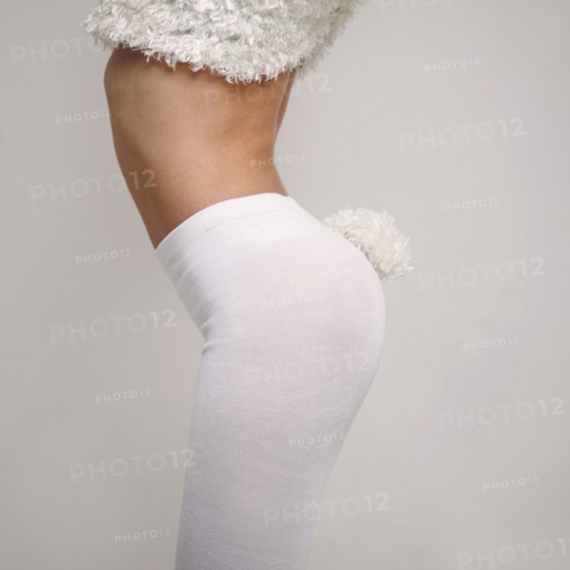 Midsection of Caucasian girl wearing rabbit costume