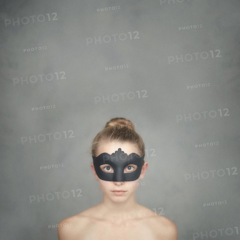 Caucasian girl wearing black mask