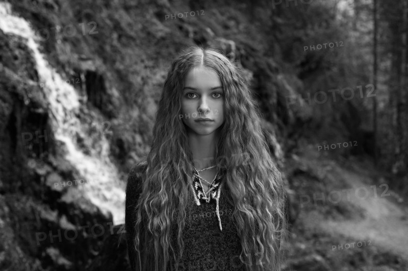 Caucasian teenage girl in forest