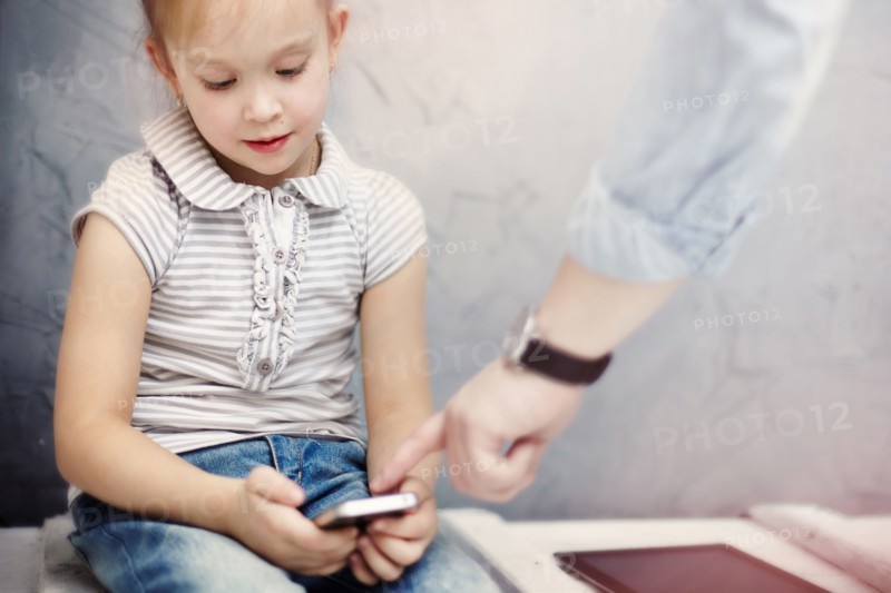 Caucasian father and daughter using digital tablet