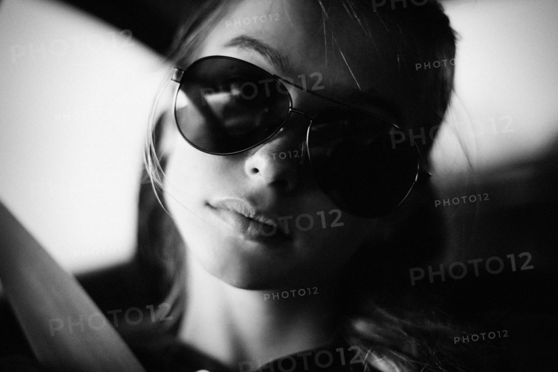 Caucasian teenage girl wearing sunglasses