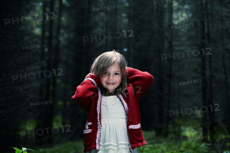 Caucasian girl smiling in forest