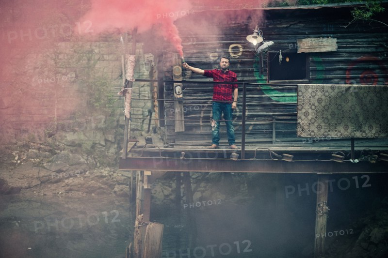 Caucasian man spraying pigment powder