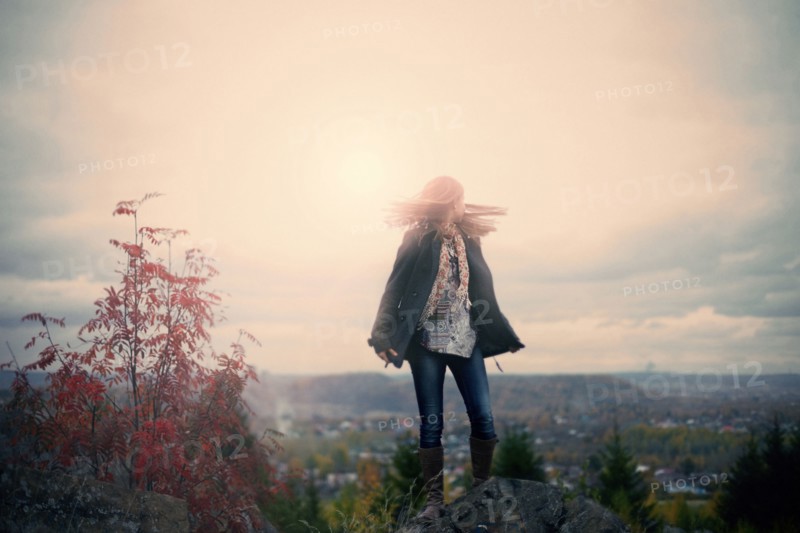 Caucasian girl standing on hilltop