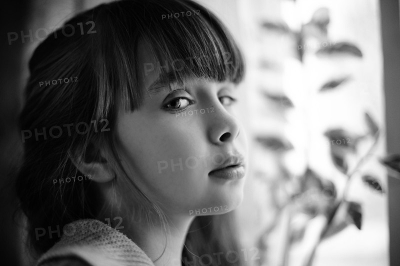 Profile of Caucasian girl with cynical expression