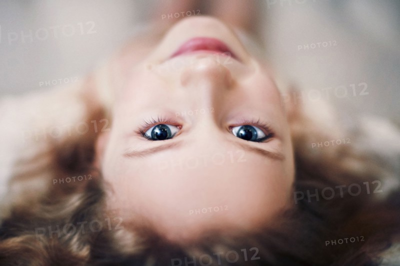 Caucasian teenage girl looking up
