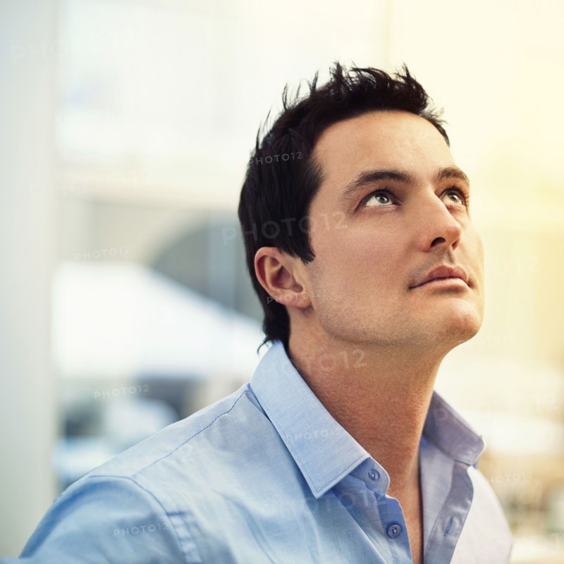Caucasian businessman looking up