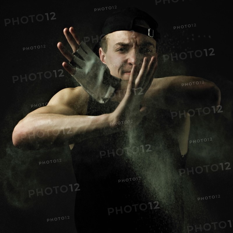 Caucasian man flexing muscles