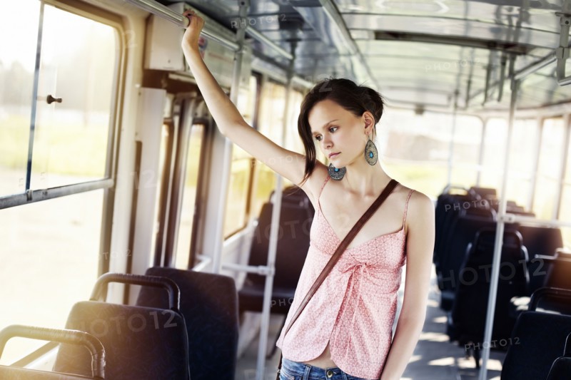 Caucasian woman riding bus