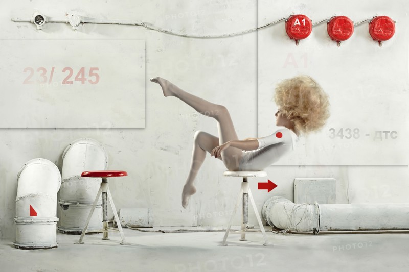 Caucasian dancer posing on stool