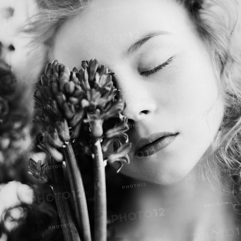 Caucasian teenage girl holding flower