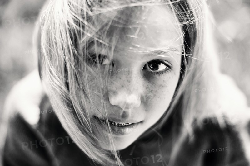 Hair of Caucasian girl with braces blowing in wind