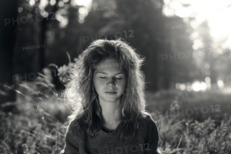 Caucasian girl with eyes closed in field
