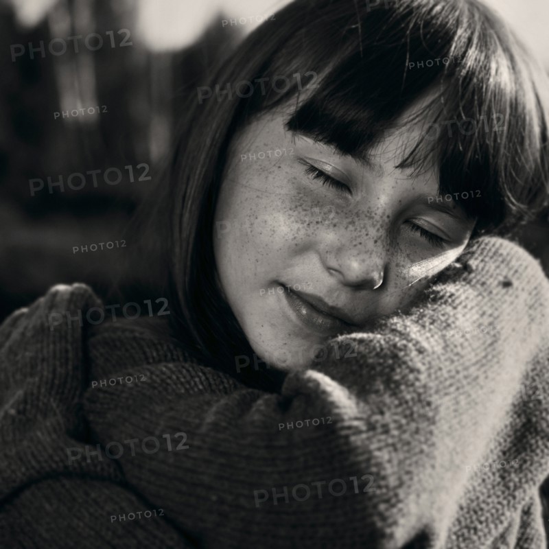 Portrait of smiling Caucasian girl wearing sweater