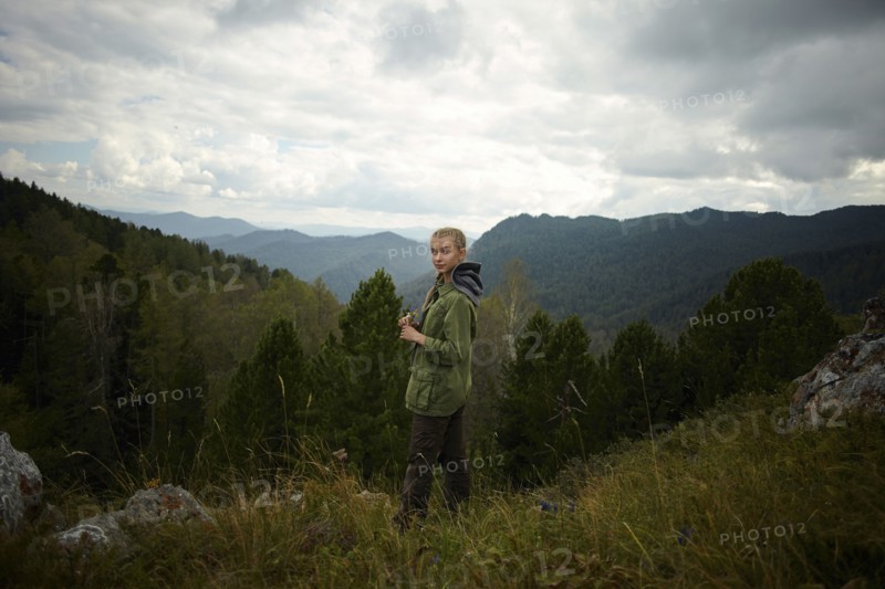 Portrait of Caucasian girl standing on mountain range