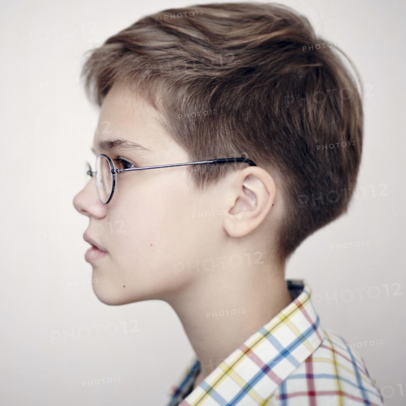 Profile of Caucasian boy wearing eyeglasses