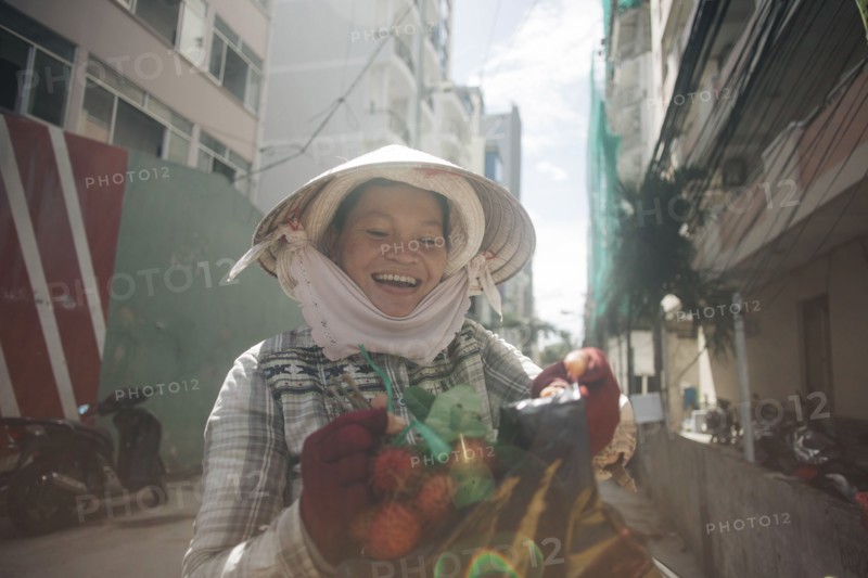 Vietnamese woman smiling in street