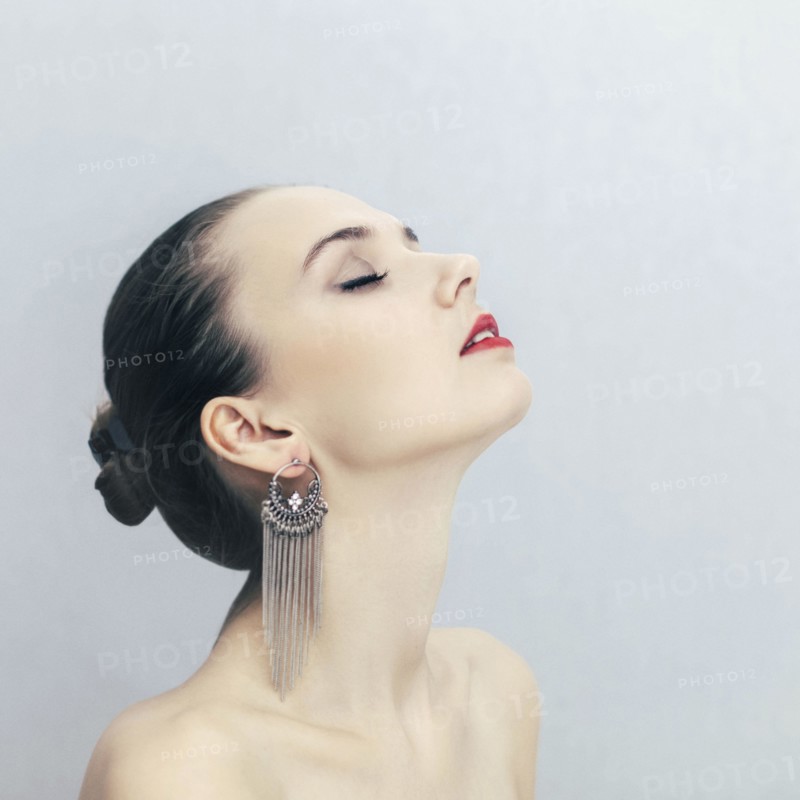 Portrait of Caucasian woman wearing earrings