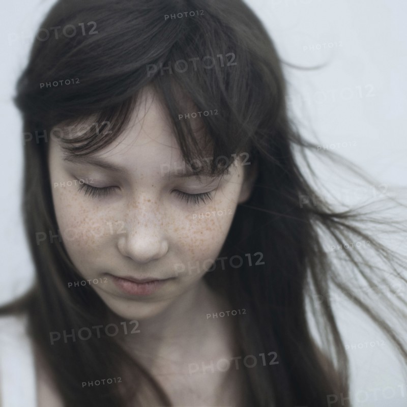 Wind blowing hair of Caucasian girl