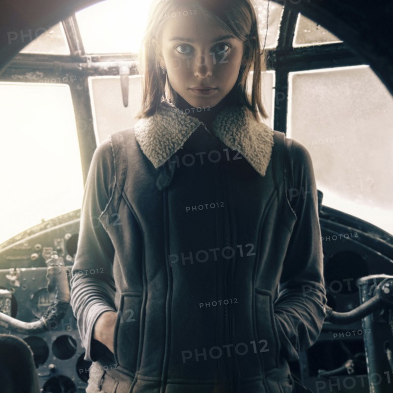 Caucasian woman standing in cockpit