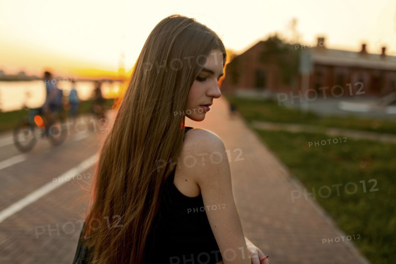 Pensive Caucasian woman at waterfront